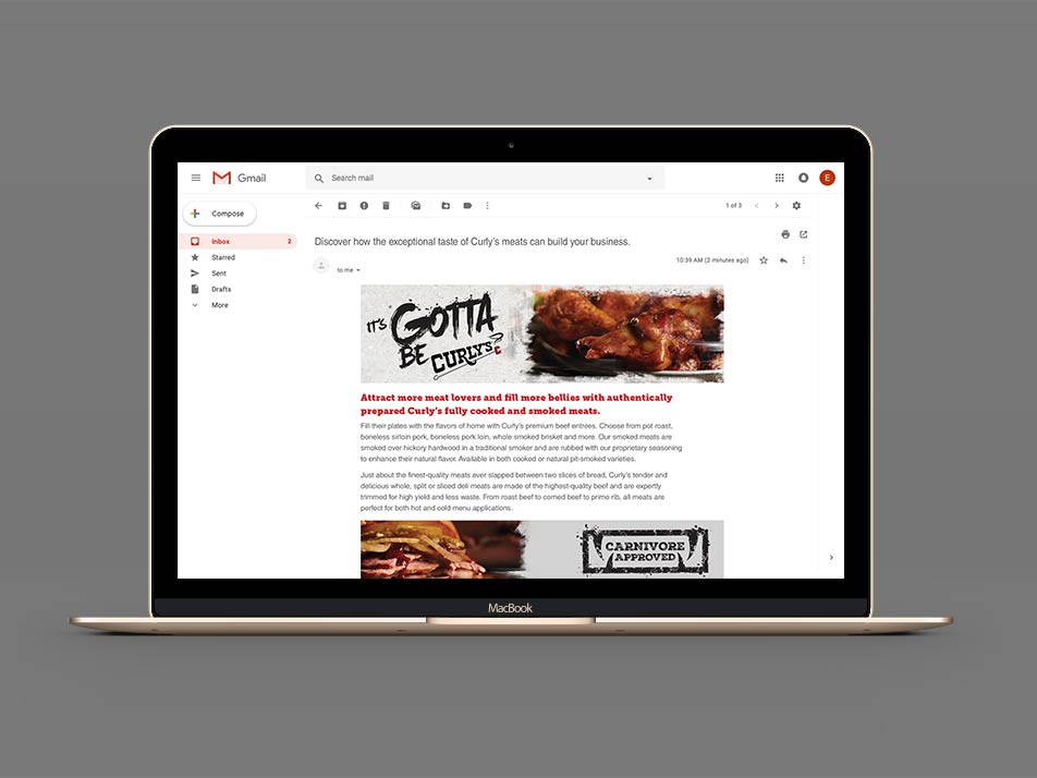 A laptop computer with an eblast on its screen promoting Curly’s barbecue and the icon Carnivore Approved.