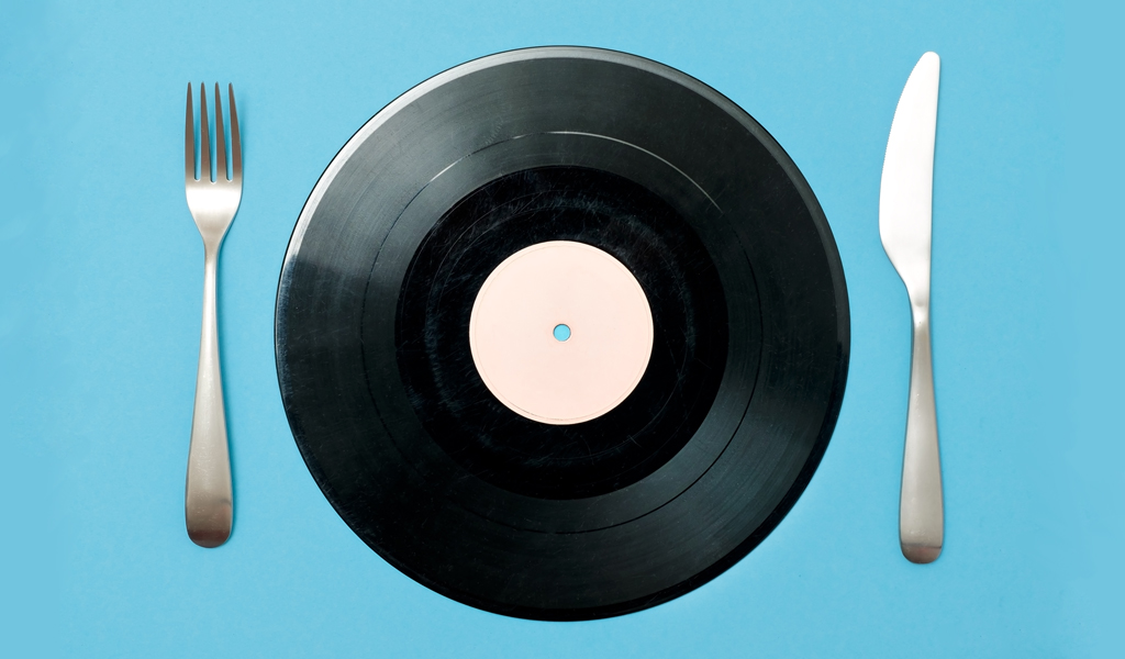 Vinyl record with fork and knife - how music influences diners